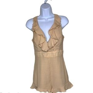 Essue sleeveless tan ruffle front romper
